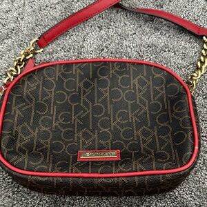 Calvin Klein Monogram Crossbody Bag in Brown and Red